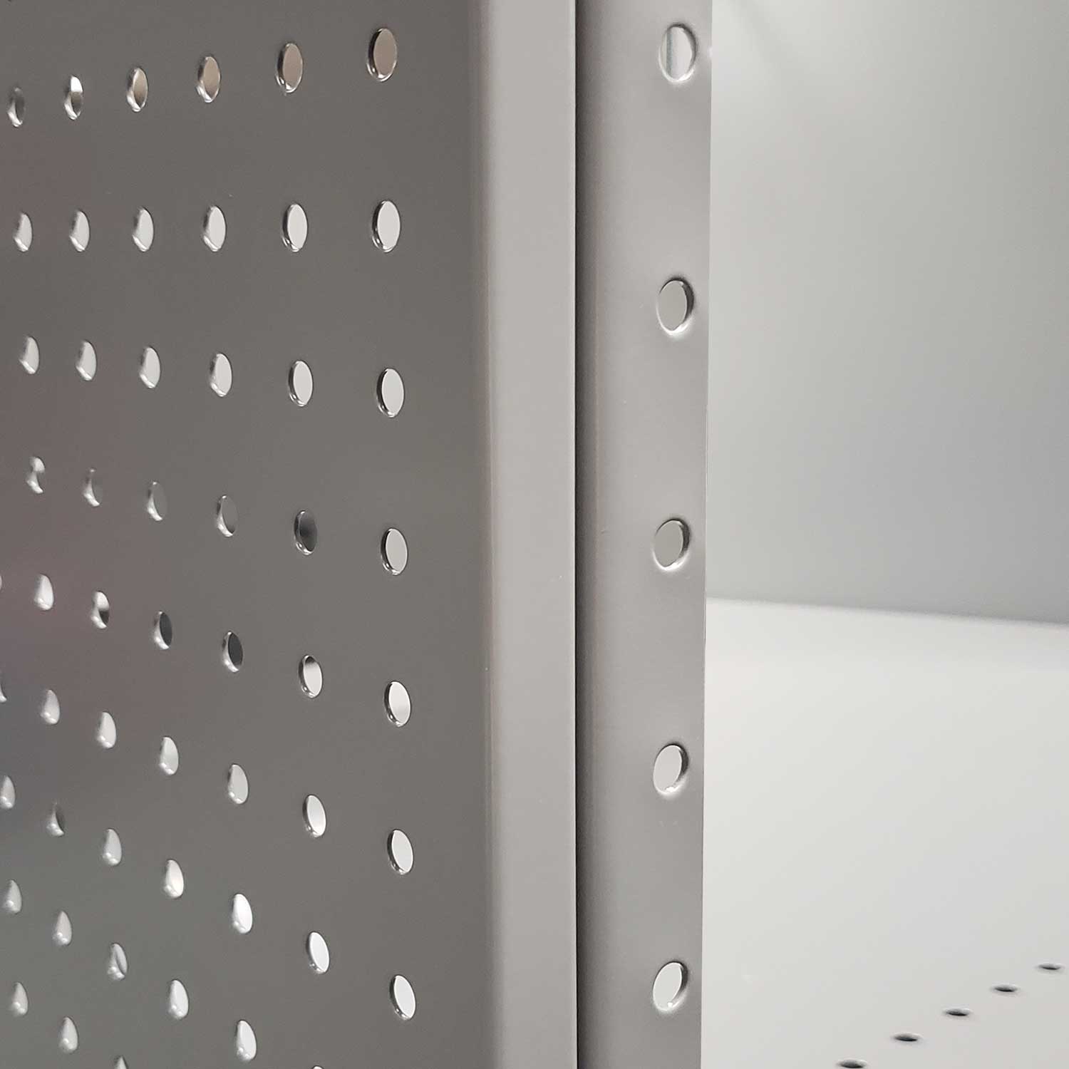 Steel pegboard panels for industrial shelving on 2000 series angle post
